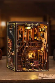 DIY book nook of an antique library scene with gothic-style arches, spiral stairs, a cozy reading nook, and glowing lamplight, styled in dark academia tones.