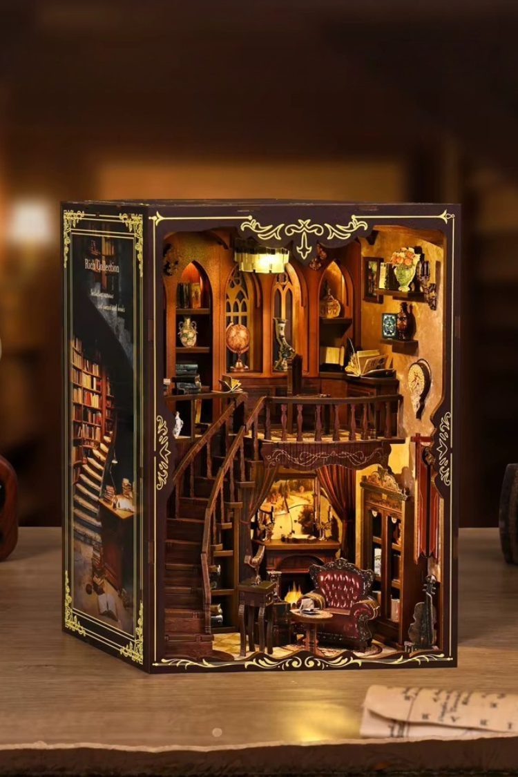 DIY book nook of an antique library scene with gothic-style arches, spiral stairs, a cozy reading nook, and glowing lamplight, styled in dark academia tones.