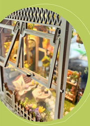 DIY garden book nook kit featuring a miniature outdoor café, greenery, tiny table setup, and rustic path — perfect for miniature lovers, DIY crafts, book nook fans, and small DIY house decor.