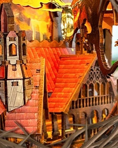 DIY fantasy book nook kit featuring a dragon-themed miniature valley with stone bridges, rooftops, and glowing landscape — ideal for miniature fans, DIY crafts, and book nook collectors.