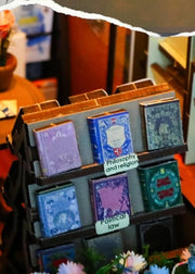DIY book nook kit featuring a miniature bookstore with tiny books, shelves, cozy lighting, and vintage details — ideal for fans of miniatures, DIY crafts, scale models, and small DIY houses.