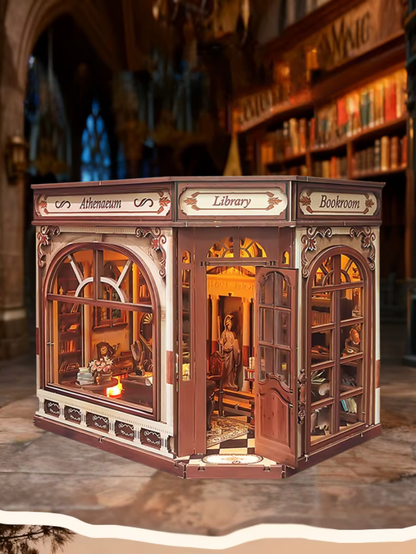 DIY miniature house kit styled as an Athenaeum library with classical columns, bookshelves, and warm lighting in an old-world study.