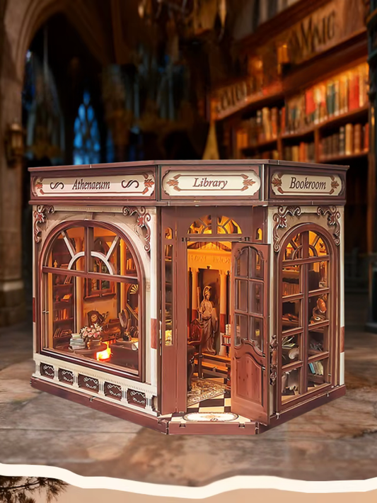 DIY miniature house kit styled as an Athenaeum library with classical columns, bookshelves, and warm lighting in an old-world study.