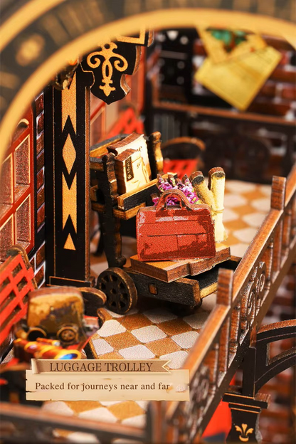 DIY book nook kit “Platform Arcane,” featuring a mechanical fantasy train station with glowing lights, gears, arched glass roof, red locomotive, and magical details. Ideal for DIY and crafts lovers, fantasy readers, and miniature train enthusiasts.