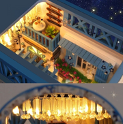 DIY and crafts lovers will enjoy this miniature book nook kit — a charming Mediterranean street scene that doubles as a bookshelf insert or home decor; perfect for craft ideas and making miniatures.