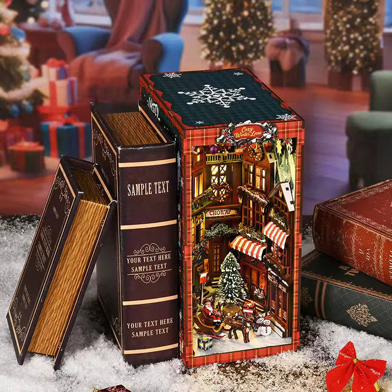 DIY book nook kit “Merry Market Lane,” featuring a warmly lit winter street with festive storefronts, snow-topped rooftops, and a softly bustling holiday vibe. A detailed DIY and crafts project perfect for holiday lovers and miniature collectors.