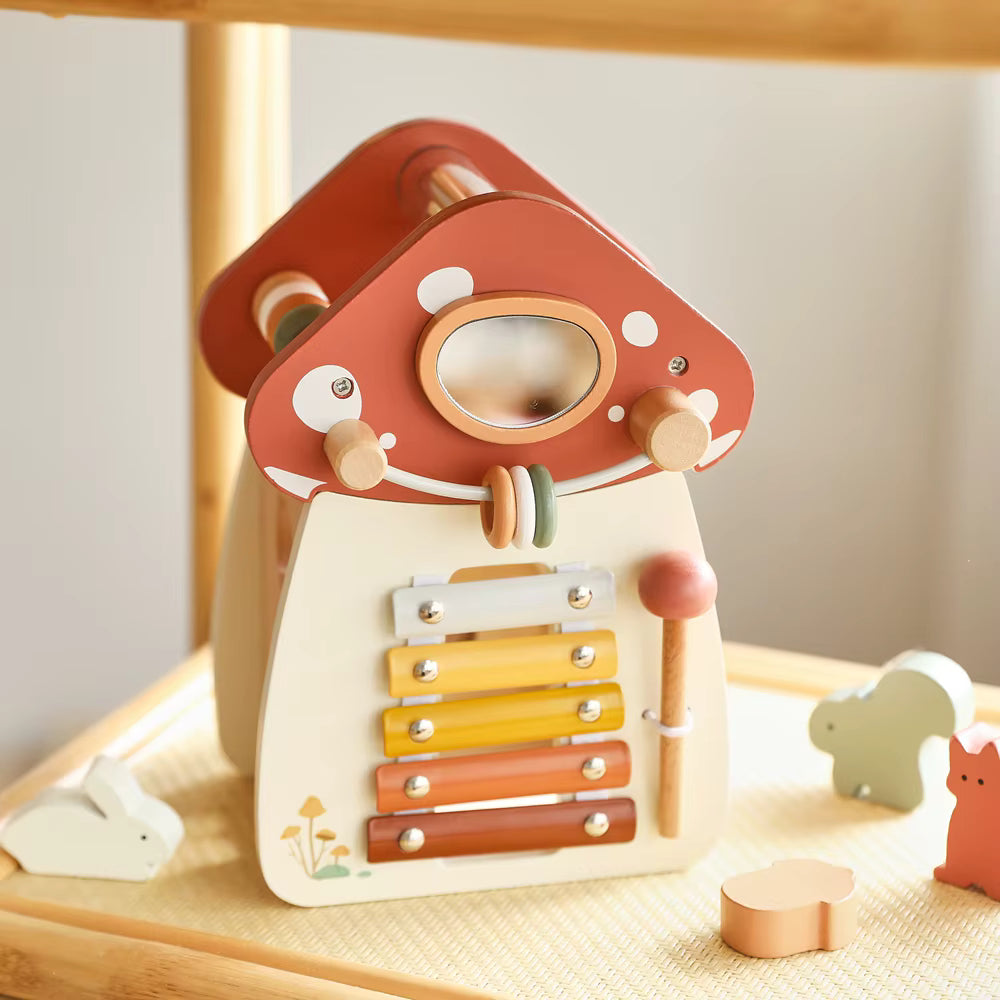 Montessori wooden mushroom house toy set with a xylophone, whimsical details, accessories, and characters, designed for imaginative pretend play and fine motor skill development.