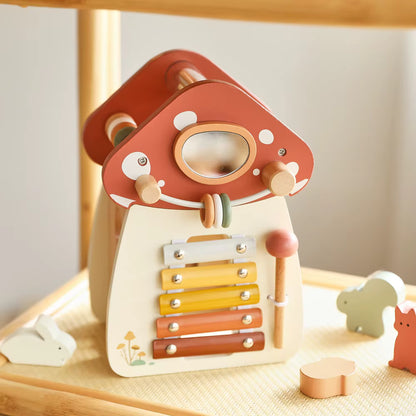 Montessori wooden mushroom house toy set with a xylophone, whimsical details, accessories, and characters, designed for imaginative pretend play and fine motor skill development.