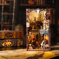 DIY miniature book nook of a Wild West street scene featuring a saloon façade with swinging doors, wooden signage, warm lantern lighting, and rustic storefront details, evoking a classic frontier town at dusk.