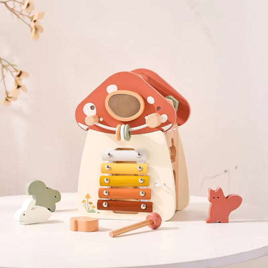 Montessori wooden mushroom house toy set with a xylophone, whimsical details, accessories, and characters, designed for imaginative pretend play and fine motor skill development.