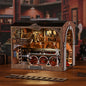 DIY miniature house kit of a vintage locomotive train repair station with intricate gears, scale model train, and glowing interior lights – perfect for craft ideas, DIY and crafts, miniature mansion lovers, and DIY book nook kit collectors.