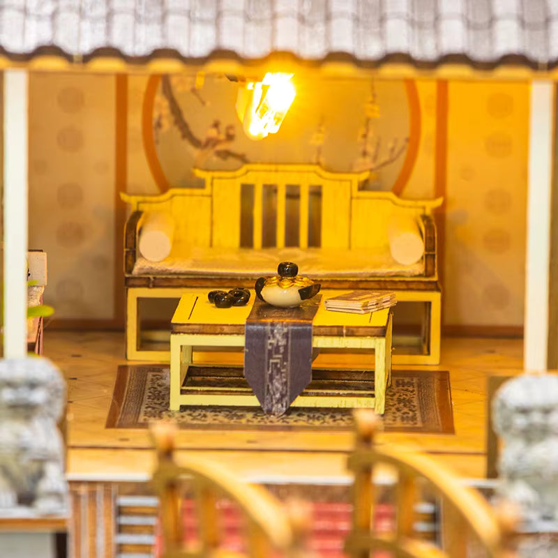 DIY miniature kit “Blossom Lantern Pavilion,” featuring a traditional East Asian-style building with curved roofs, cherry blossom trees, red lanterns, a waterfall, and glowing lights. A serene DIY and crafts project for fans of miniature homes and nature-inspired design.