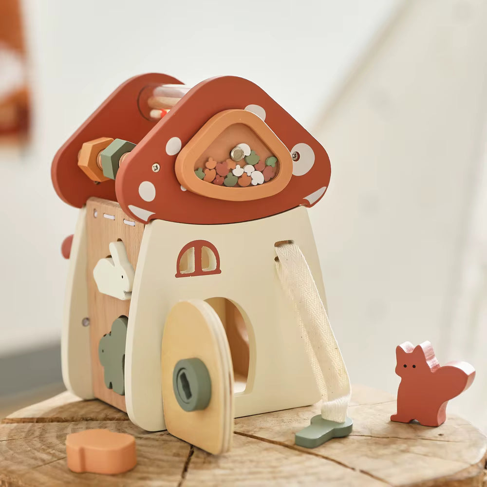 Montessori wooden mushroom house toy set with a xylophone, whimsical details, accessories, and characters, designed for imaginative pretend play and fine motor skill development.