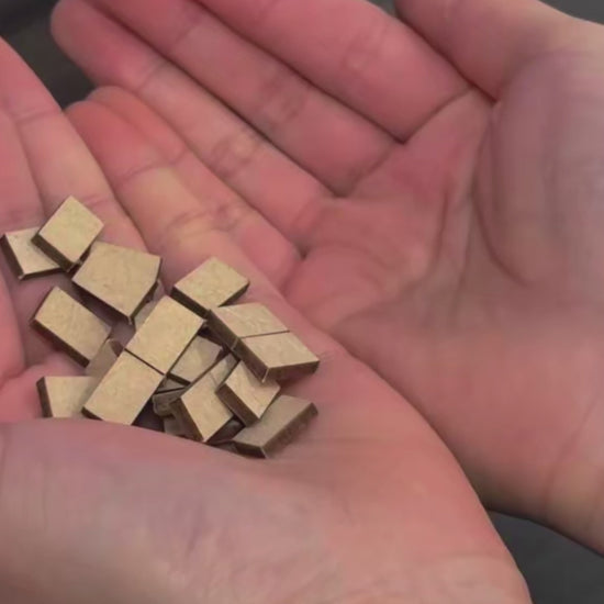 DIY book nook of a Japanese-style tea alcove featuring a glowing paper lantern, bonsai rock garden, shoji screen doors, bookshelves, and a peaceful wooden table, evoking the quiet ambiance of a neighborhood tea house.