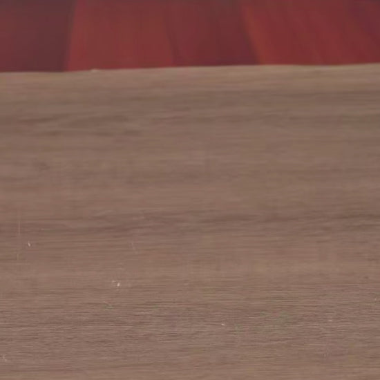 DIY book nook of an antique library scene with gothic-style arches, spiral stairs, a cozy reading nook, and glowing lamplight, styled in dark academia tones.