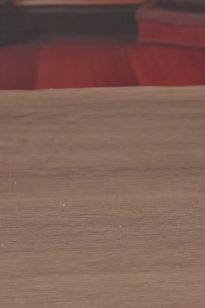 DIY book nook of an antique library scene with gothic-style arches, spiral stairs, a cozy reading nook, and glowing lamplight, styled in dark academia tones.