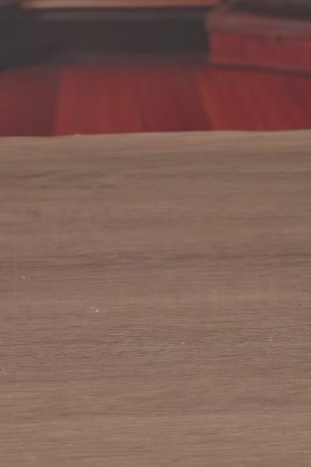 DIY book nook of an antique library scene with gothic-style arches, spiral stairs, a cozy reading nook, and glowing lamplight, styled in dark academia tones.