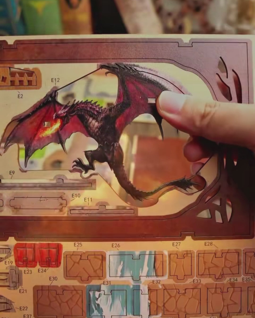 DIY fantasy book nook kit featuring a dragon-themed miniature valley with stone bridges, rooftops, and glowing landscape — ideal for miniature fans, DIY crafts, and book nook collectors.