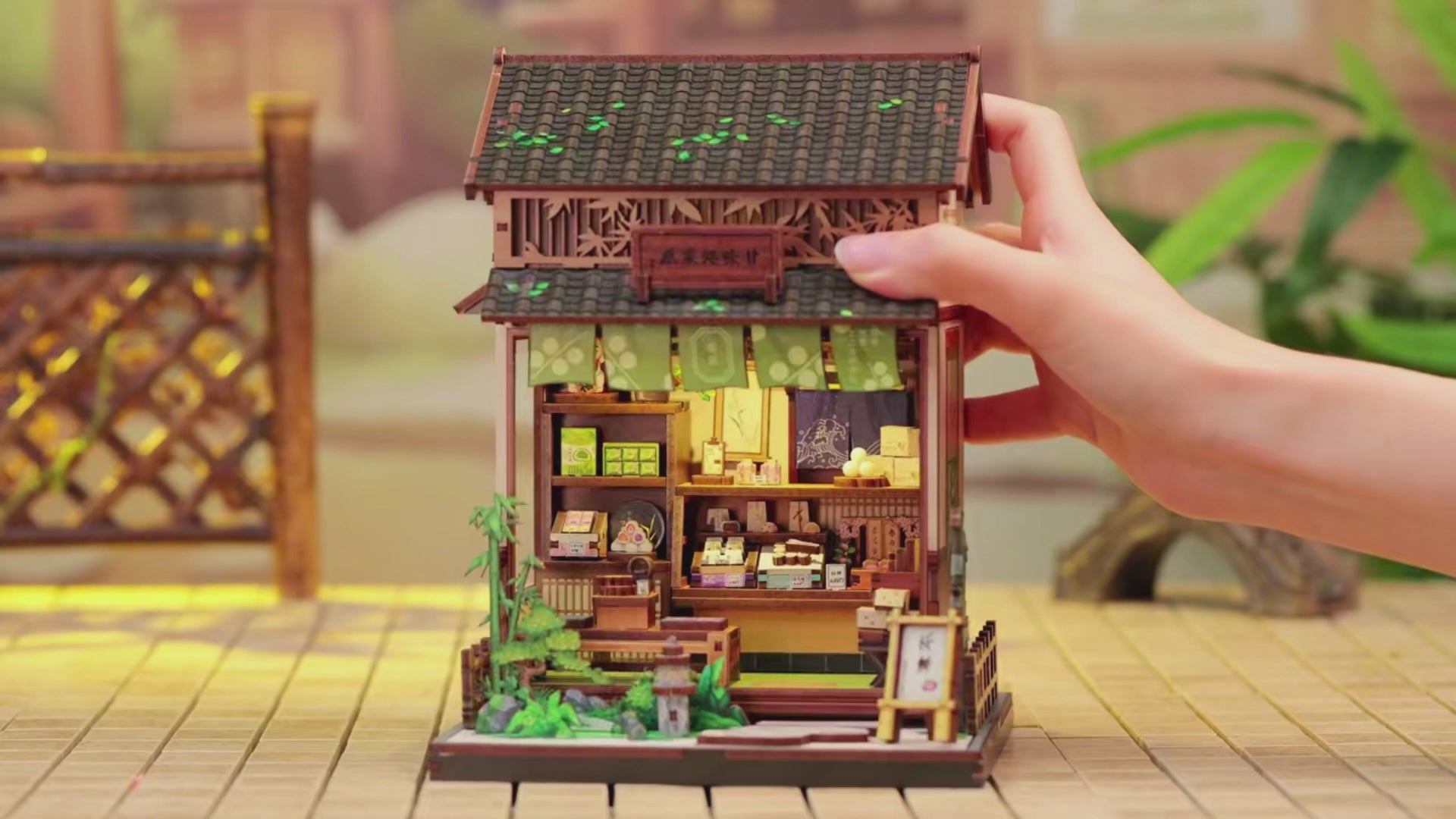 DIY mini house kit “Japanese Sweets Store,” featuring a traditional candy and wagashi shop with miniature desserts, wooden shelves, hanging banners, and tiny gift boxes. A detailed DIY and crafts project perfect for fans of Japanese culture and making miniatures.
